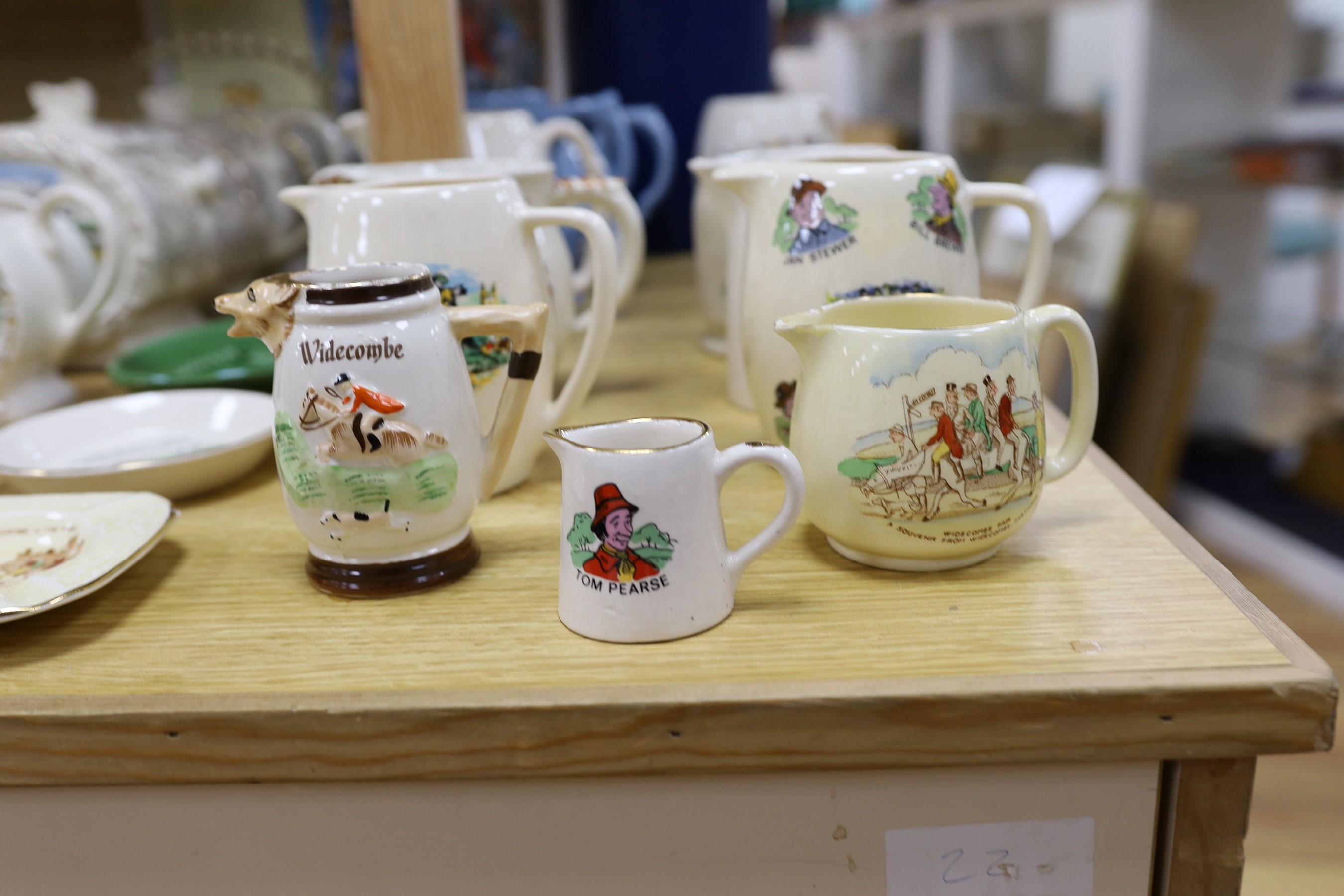 A quantity of novelty items relating to Widecombe Fair, to include jugs, teapots etc.